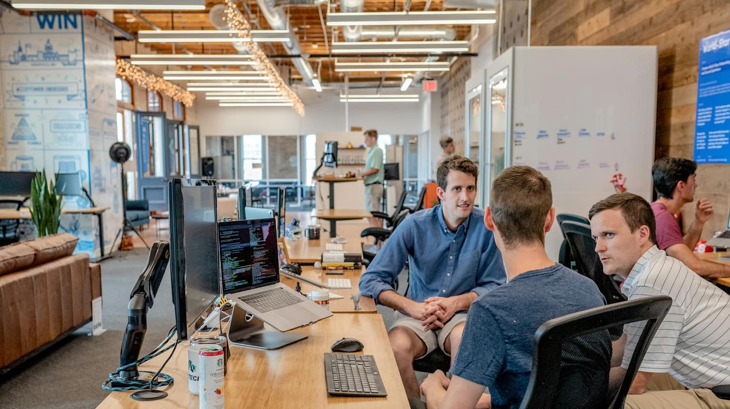 An advisory team working together in an open office