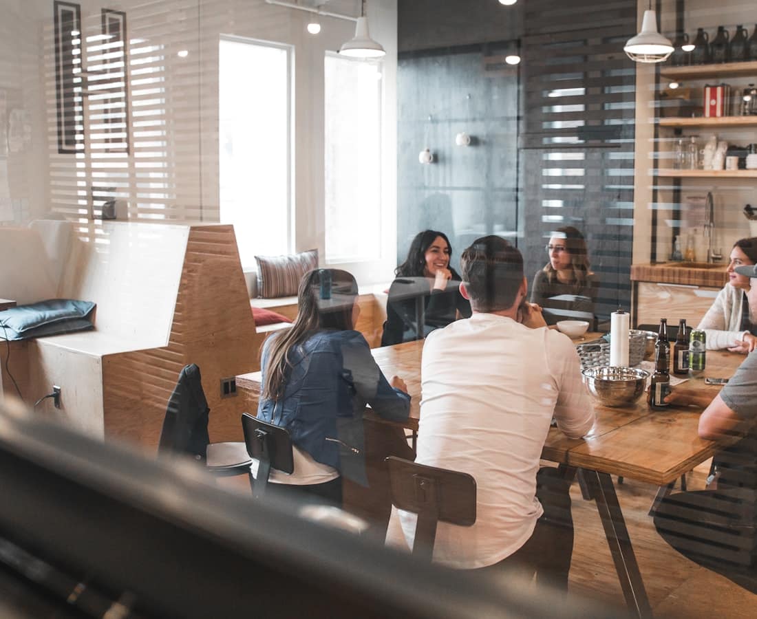 A team in a glass-walled meeting room